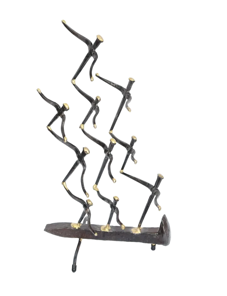 Freestanding metal sculpture of nine abstract gull figures made of steel cut nails, welded together and the wings tipped with bronze, with the group mounted on a railroad spike
