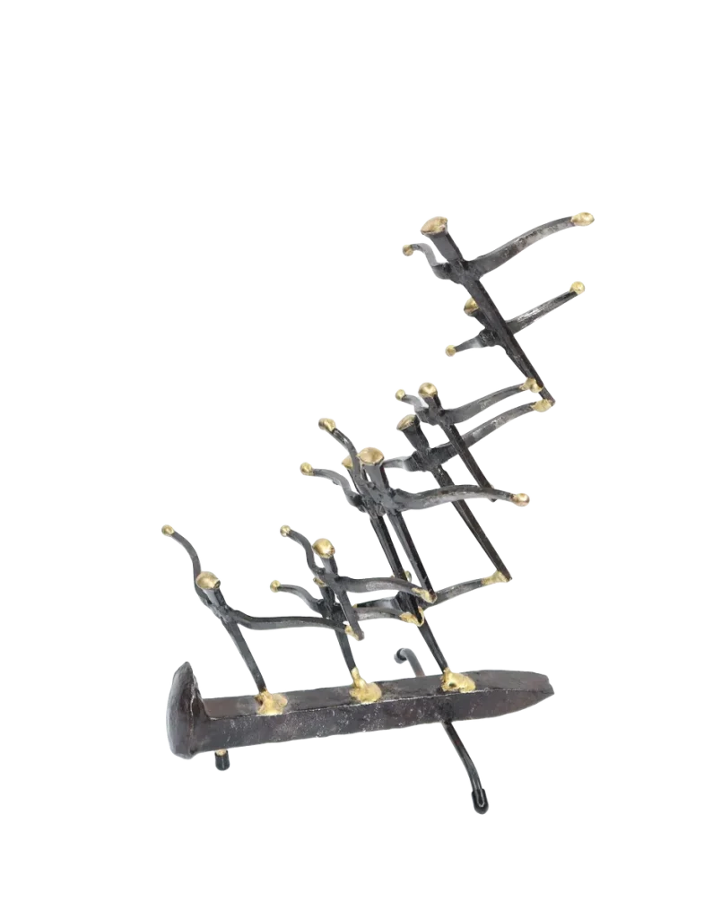 Freestanding metal sculpture of nine abstract gull figures made of steel cut nails, welded together and the wings tipped with bronze, with the group mounted on a railroad spike