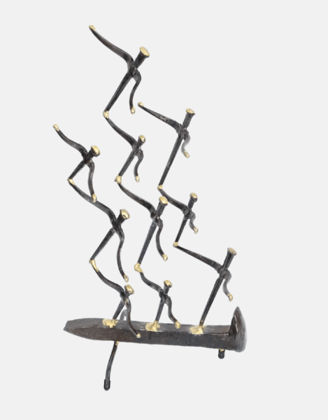 Freestanding metal sculpture of nine abstract gull figures made of steel cut nails, welded together and the wings tipped with bronze, with the group mounted on a railroad spike