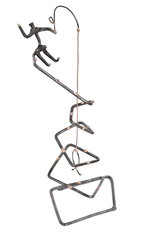 Freestanding abstract metal sculpture of a fisherman atop of and fishing from a spiraled steel tower with bronze dotted accents. The fisherman is made of steel cut nails and depicted waving with one hand, steel fishing pole in other hand with a copper fish on the end of a copper fishing line.