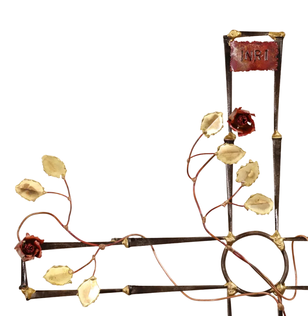 Ornate wall-mounted metal sculpture cross, made of steel cut nails and decorated with copper vines, brass leaves and copper roses. It is symbolic of the pain, suffering and resurrection of Jesus after crucifixion.