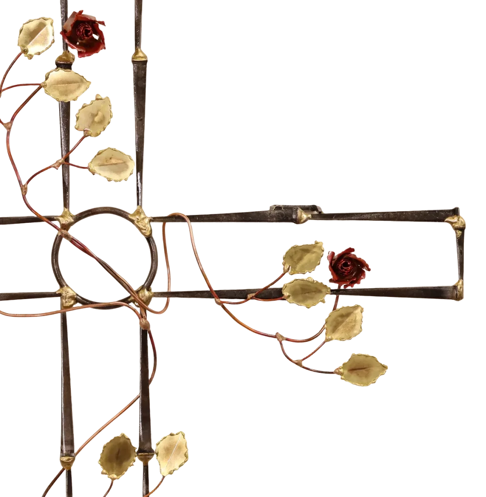 Ornate wall-mounted metal sculpture cross, made of steel cut nails and decorated with copper vines, brass leaves and copper roses. It is symbolic of the pain, suffering and resurrection of Jesus after crucifixion.